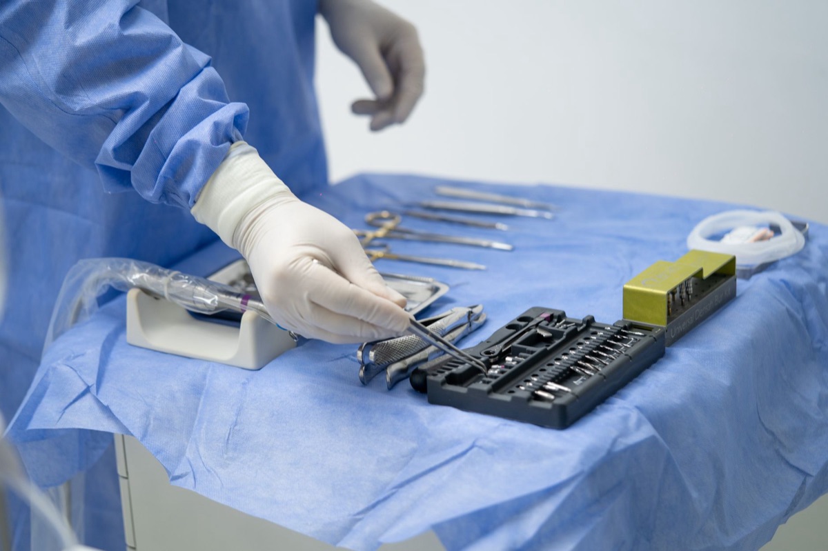 camera looking at a hospital room with a surgical tray and medical equipment